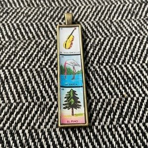 Bronze loteria pendant approx 3 inches long